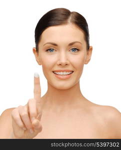 picture of beautiful woman with moisturizing creme drop.