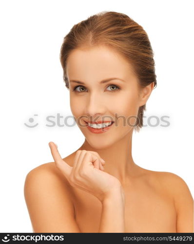 picture of beautiful woman with moisturizing creme drop.