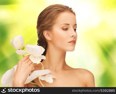 picture of beautiful woman with orchid flower