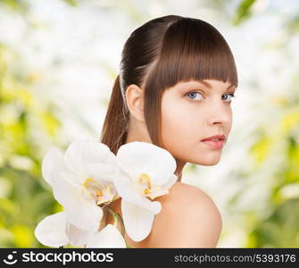 picture of beautiful woman with orchid flower