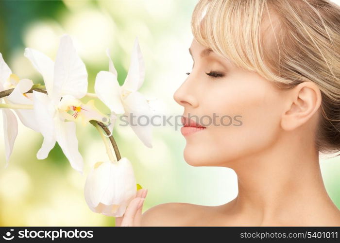 picture of beautiful woman with orchid flower