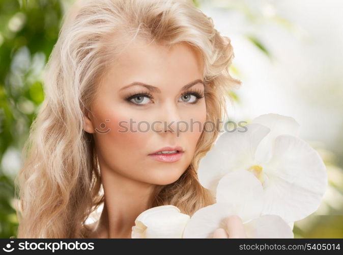 picture of beautiful woman with orchid flower