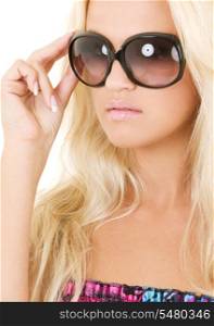 picture of blonde in big shades over white