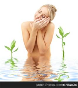 picture of blonde with flower petals and green plants in spa