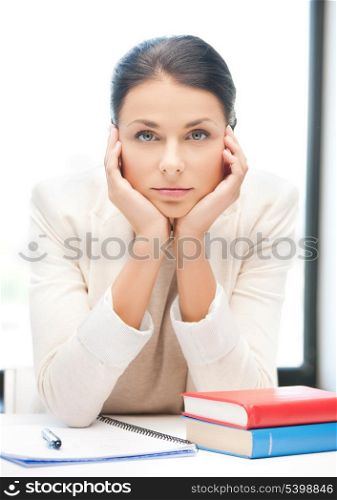 picture of bored and tired woman behid the table