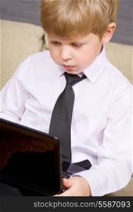 picture of boy with black laptop computer