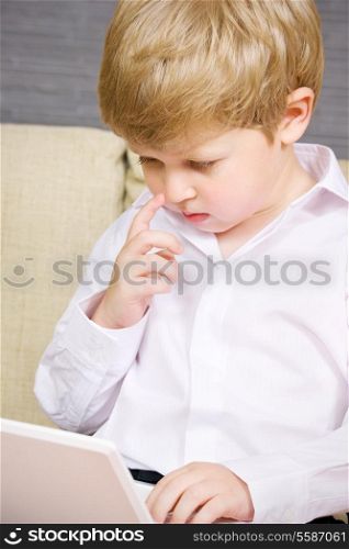 picture of boy with white laptop computer