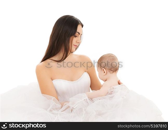 picture of bride in white dress with little baby
