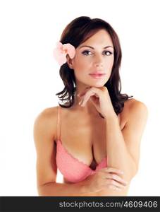 Picture of brunet female wearing sexy pink bra, closeup portrait of attractive young lady in underwear isolated on white background, cute female with orchid flower in hair, healthcare and spa concept