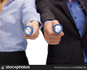 picture of business team holding pocket flashlights
