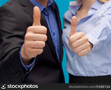 picture of business team showing thumbs up