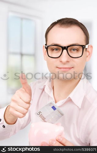 picture of businessman with piggy bank and money