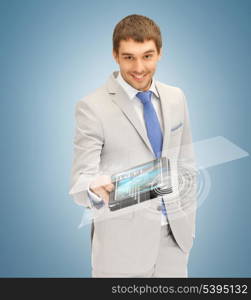 picture of businessman with tablet pc and virtual screen