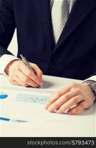 picture of businessman working and signing paper