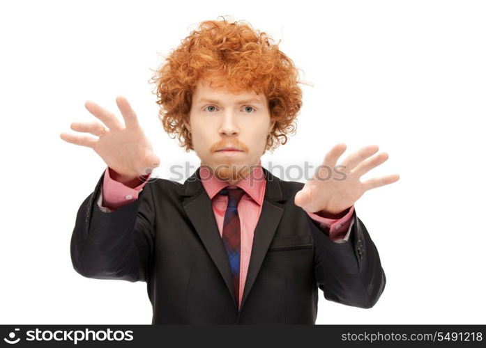 picture of businessman working with something imaginary