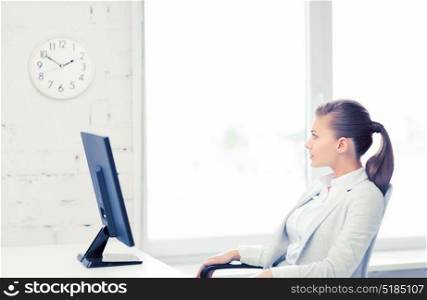 picture of businesswoman looking at wall clock in office. businesswoman looking at wall clock in office