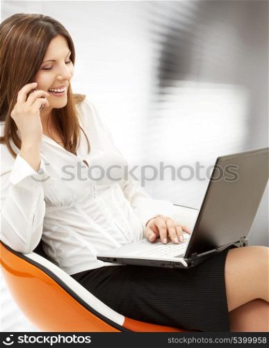 picture of businesswoman with laptop and cell phone