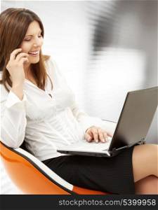picture of businesswoman with laptop and cell phone