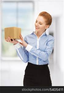 picture of businesswoman with parcel in office
