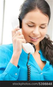 picture of businesswoman with rotary phone calling