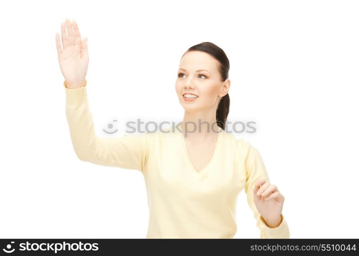 picture of businesswoman working with something imaginary