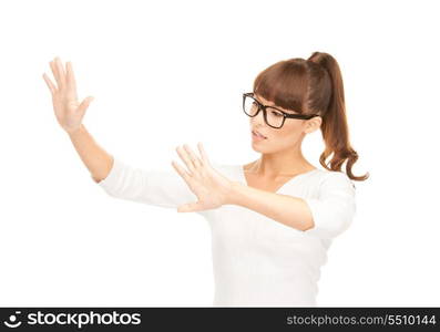 picture of businesswoman working with something imaginary