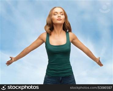 picture of calm and serious woman spreading hands