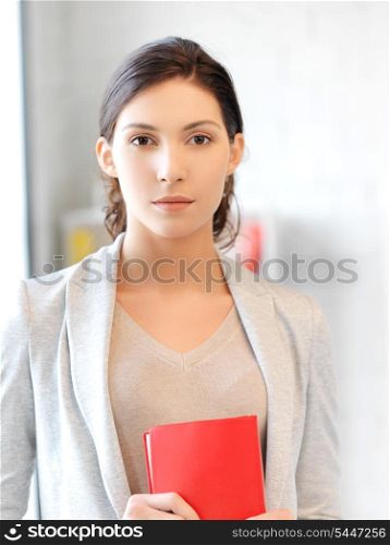 picture of calm and serious woman with book
