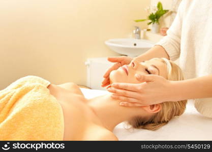 picture of calm beautiful woman in massage salon