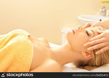 picture of calm beautiful woman in massage salon