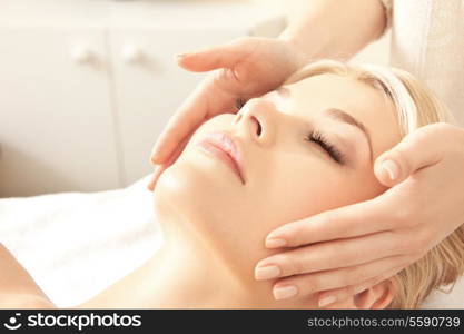 picture of calm beautiful woman in massage salon