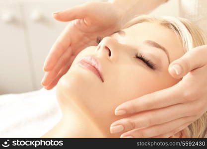 picture of calm beautiful woman in massage salon