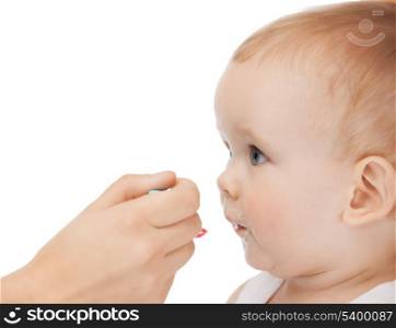 picture of calm mother feeding adorable baby.