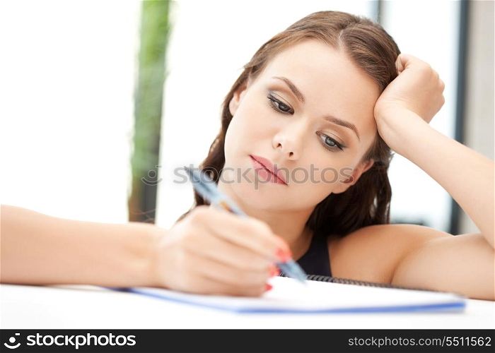 picture of calm woman with big notepad