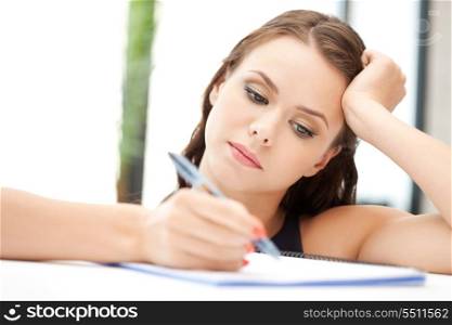 picture of calm woman with big notepad