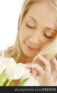 picture of cheerful blond with white tulips