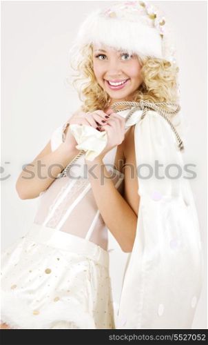 picture of cheerful santa helper girl with big bag
