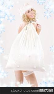 picture of cheerful santa helper girl with big bag