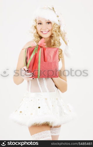 picture of cheerful santa helper girl with gift box