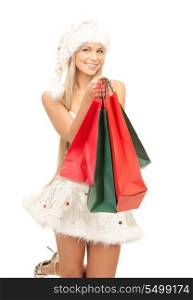 picture of cheerful santa helper with shopping bags