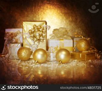 Picture of Christmastime gift boxes isolated on dark golden background, luxury Christmas decorations, seasonal shopping, shiny balls, festive ornament, New Year present, holiday greeting card