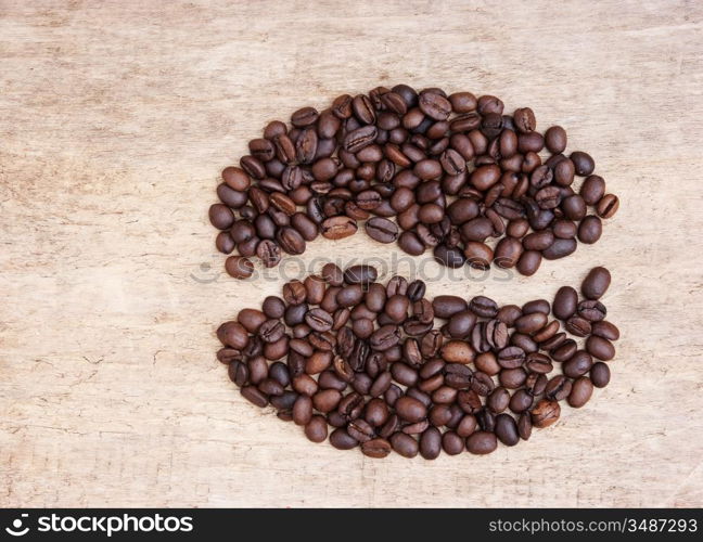 picture of coffee beans on a wooden background