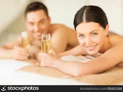 picture of couple in spa salon drinking champagne. couple in spa