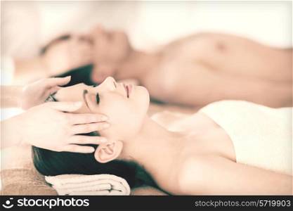picture of couple in spa salon getting face treatment