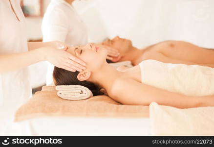 picture of couple in spa salon getting face treatment. couple in spa