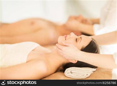 picture of couple in spa salon getting face treatment. couple in spa