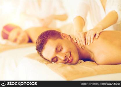 picture of couple in spa salon getting massage. couple in spa