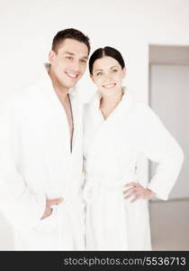 picture of couple in spa salon in white bathrobes