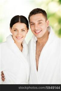 picture of couple in spa salon in white bathrobes. couple in spa