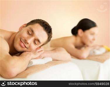 picture of couple in spa salon lying on the massage desks. couple in spa